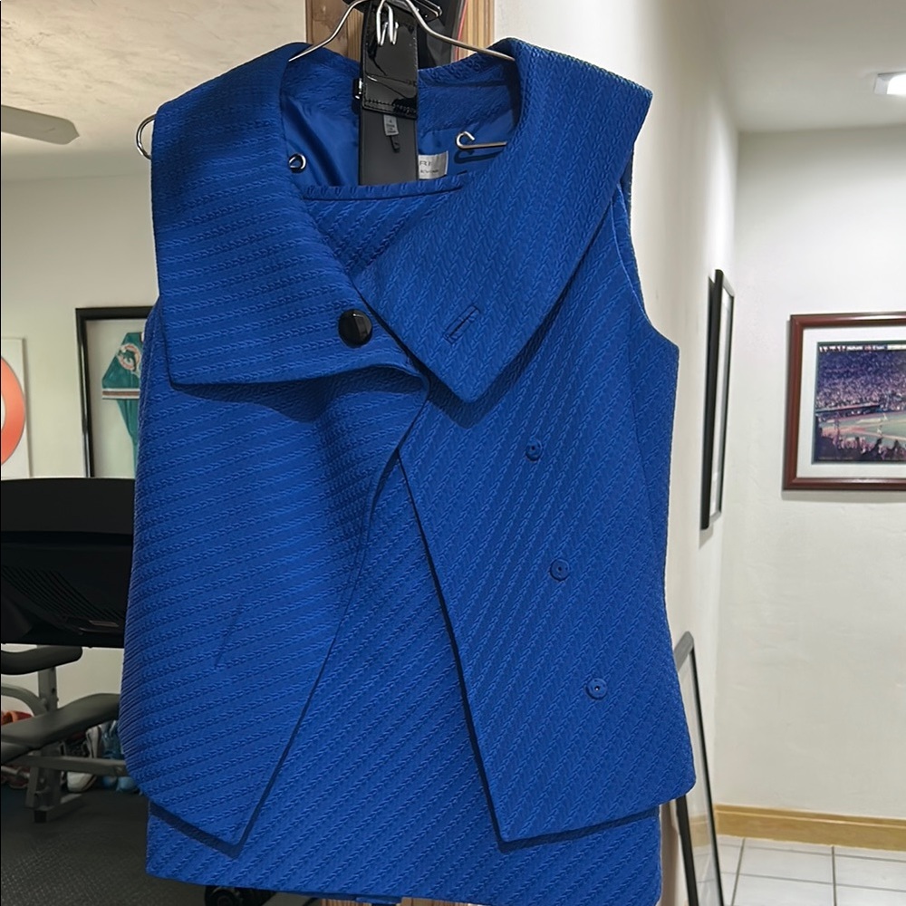 Stylish and  Stunning Blue Sleeveless Suit with big black patent leather belt